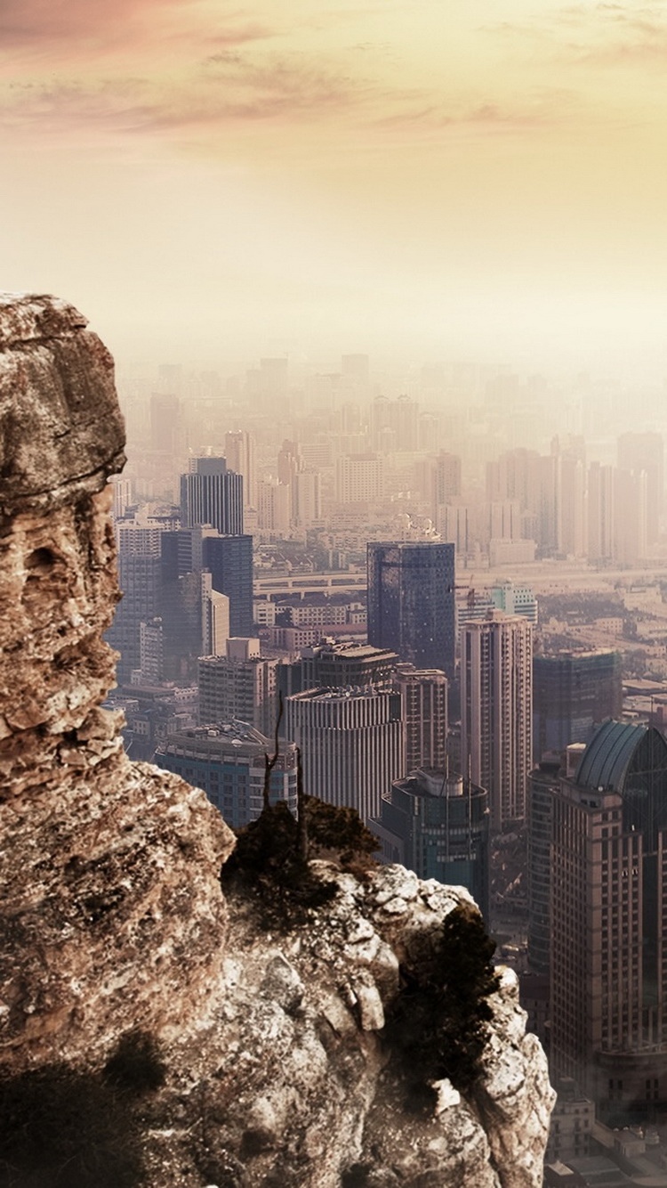 Cityscape Beside Mountain Cliff