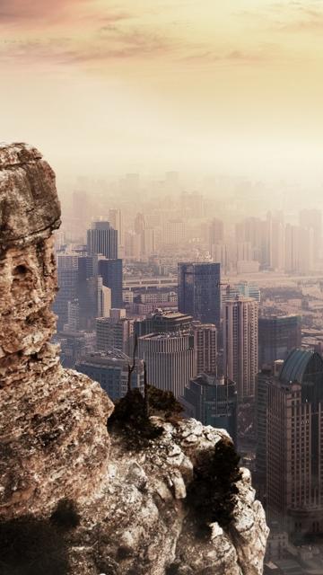 Cityscape Beside Mountain Cliff